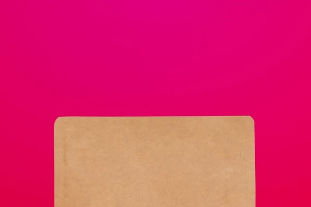 A Röststätte coffee bag stamped EST 2003 on a bright pink background
