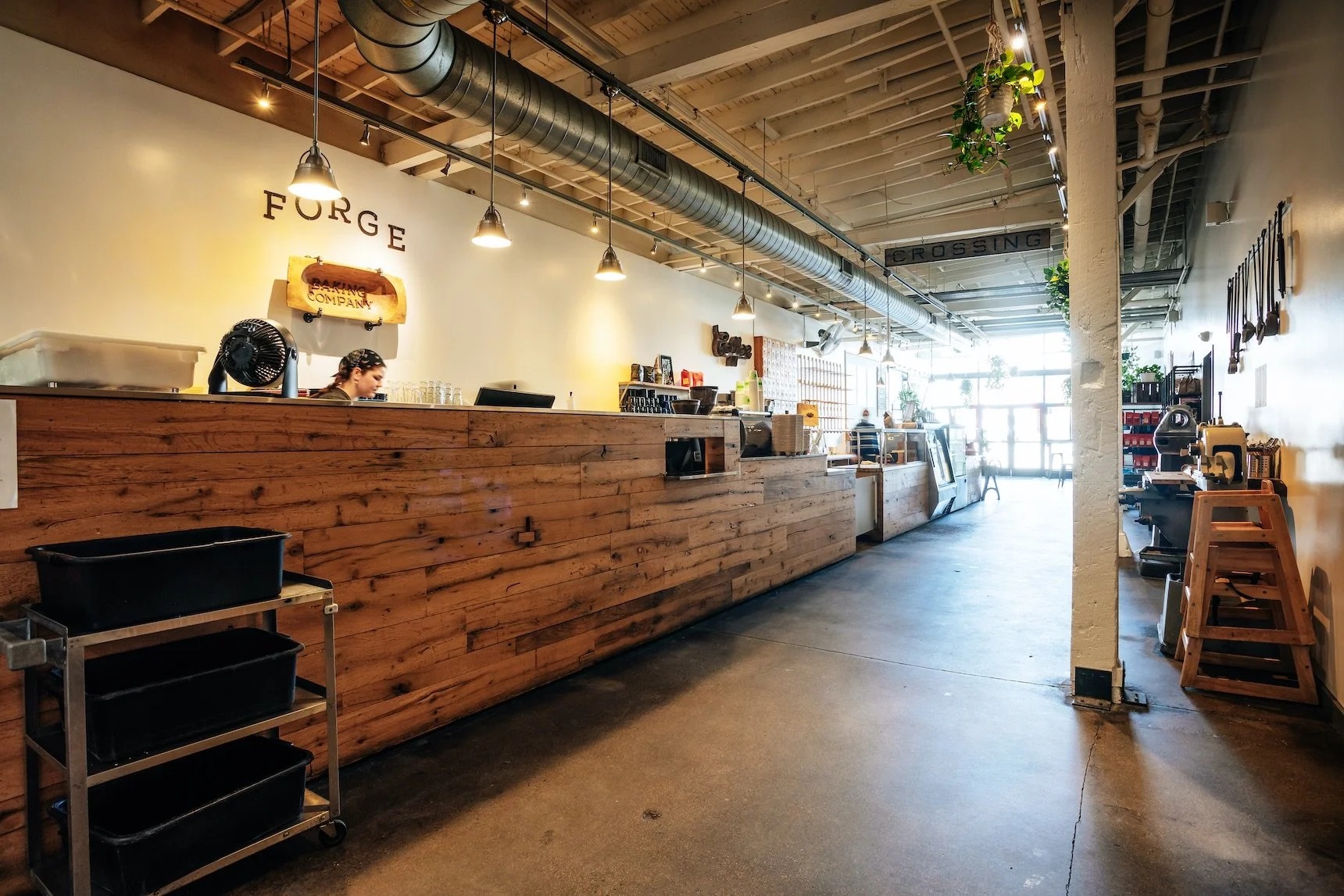 The wooden counter and Forge Baking Company wall sign inside the Union Square cafe