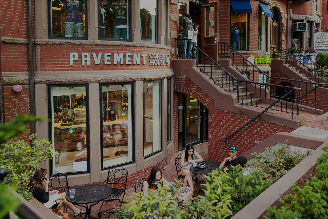 The Newbury Street storefront of Pavement Coffeehouse with its brick patio out front