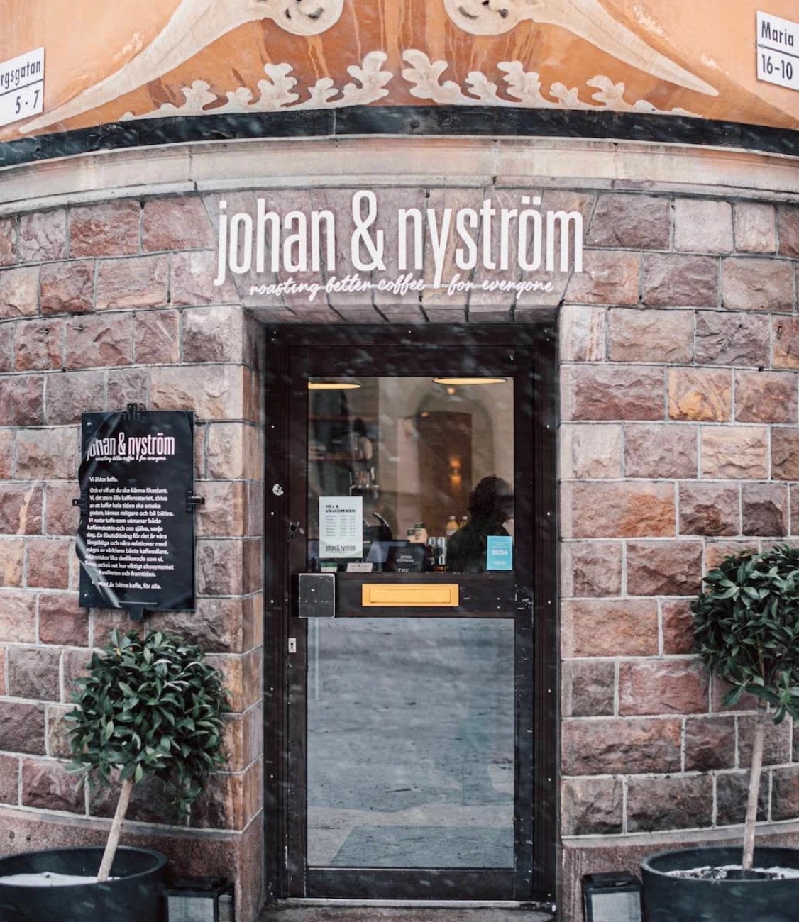 The stone storefront of Johan & Nystrom on Swedenborgsgatan, with the wordmark lettered above the glass entrance door