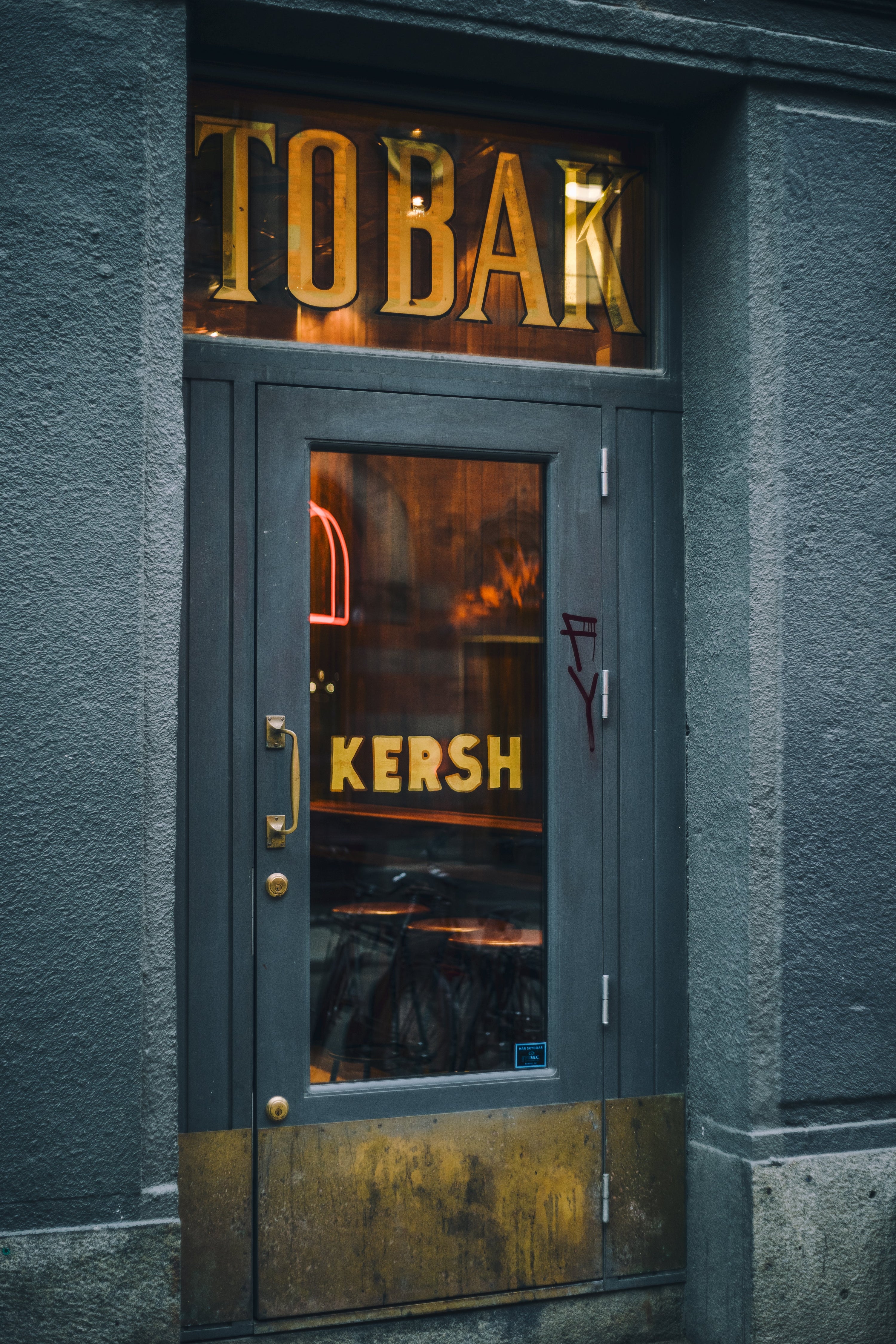 The Kersh storefront door on Gotgatan, kept under the old TOBAK tobacco shop signage